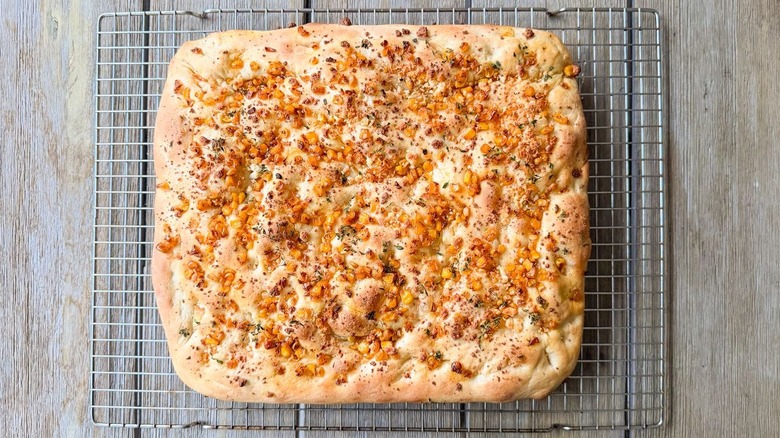 Summer corn and roasted garlic focaccia cooling on rack