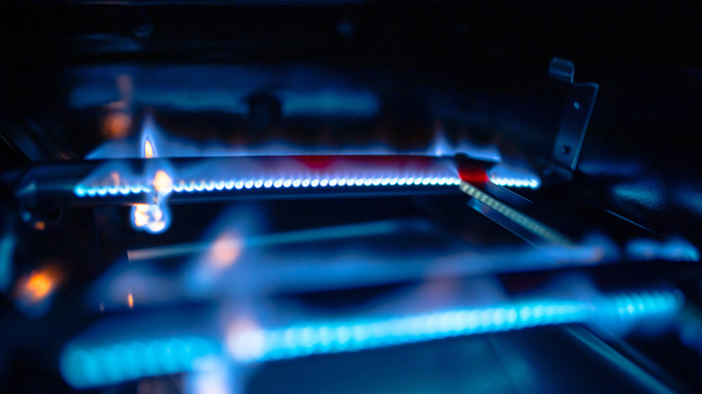Gas burner tubes being lit