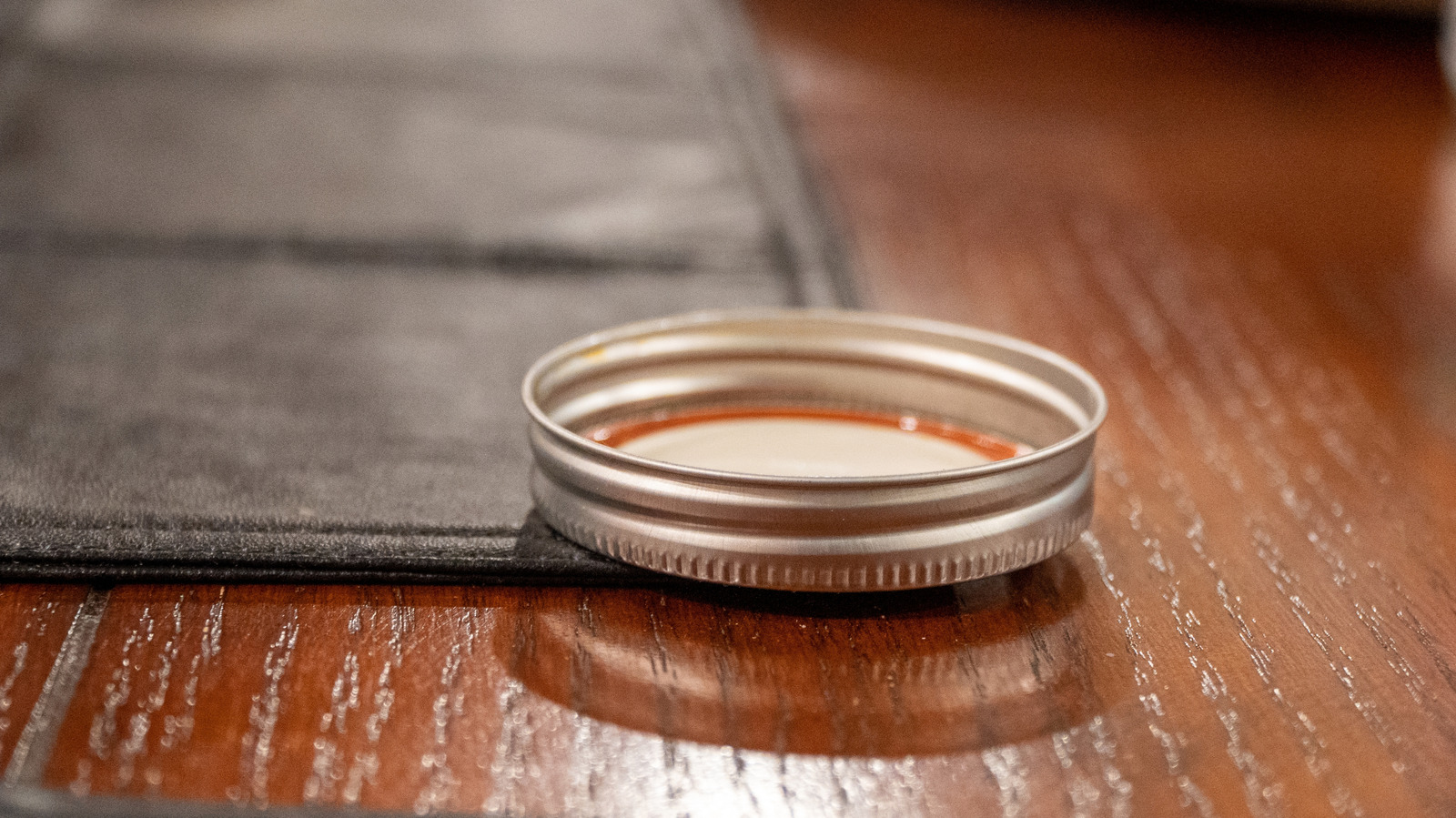 Missing A Mason Jar Lid? The Top To This Pantry Staple Fits Perfectly

