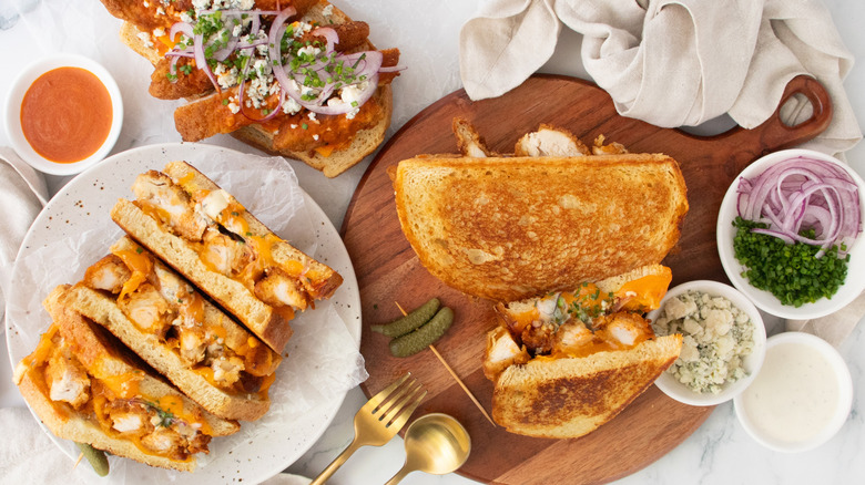 An overhead shot of several buffalo chicken grilled cheese sandwiches.