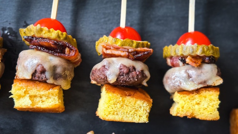 Close up of cheeseburger skewers