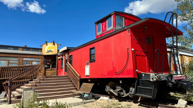 Exterior and entrance with red train of Victoria Station restaurant