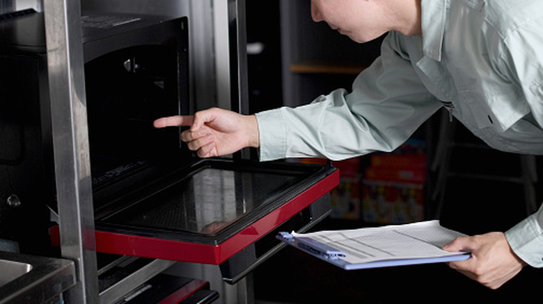 Person inspecting a range