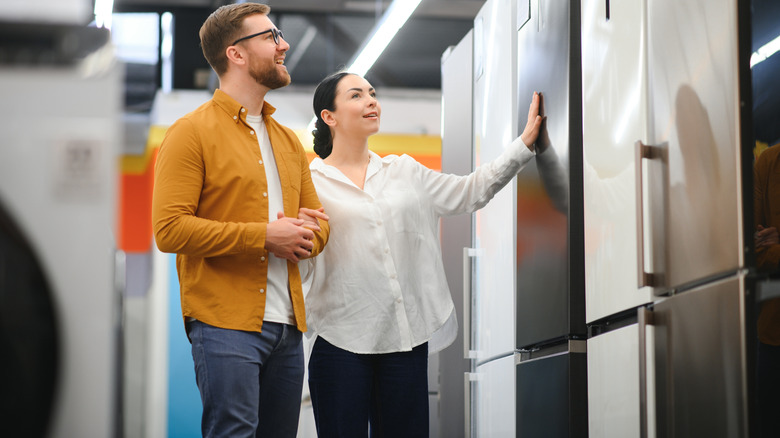 Person looking at fridges in an appliance store