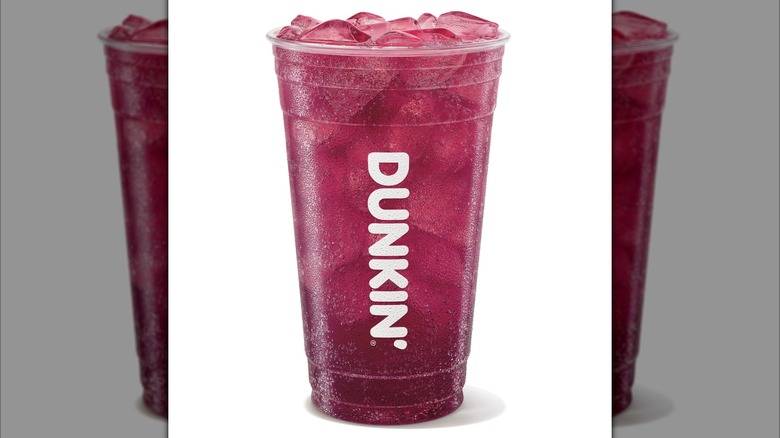 Glamberry Dunkin' Zero drink in Dunkin' clear plastic cup on a white background