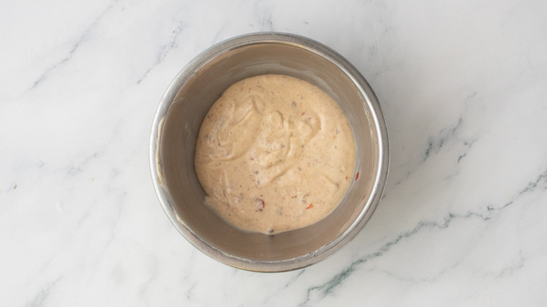 A medium bowl filled with a composed special sauce