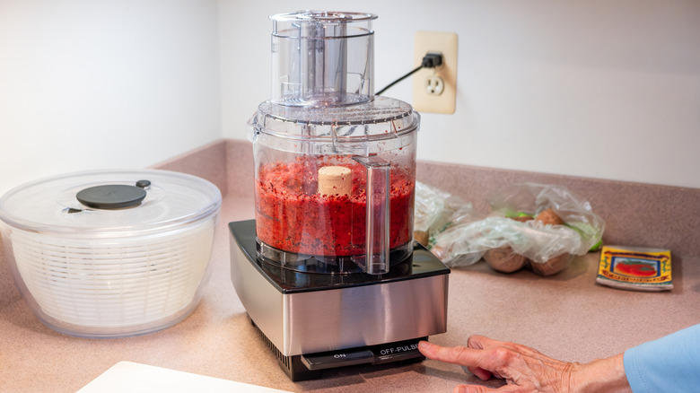 A food processor with chrome detail.