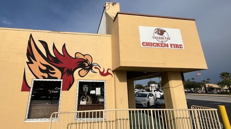Exterior view of Chicken Fire building with fire-breathing chicken graphics