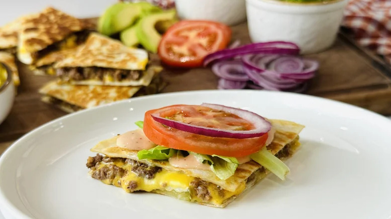 Loaded cheeseburger quesadillas served on a white plate