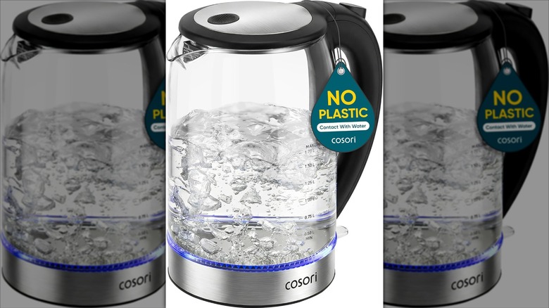 Stock image of the Cosori plastic-less kettle boiling water.