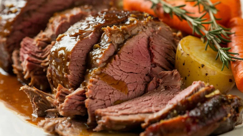 Savory pot roast with rosemary, potatoes, and carrots