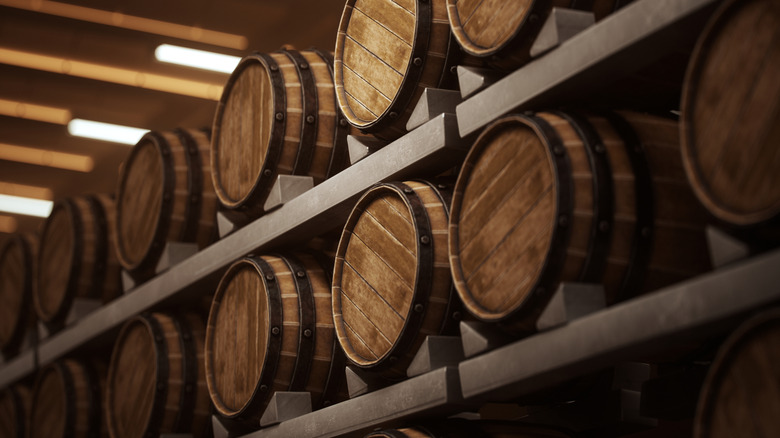 Rows of oak barrels holding Scotch whisky.