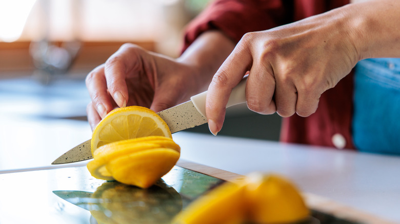 Person cutting food with a knife
