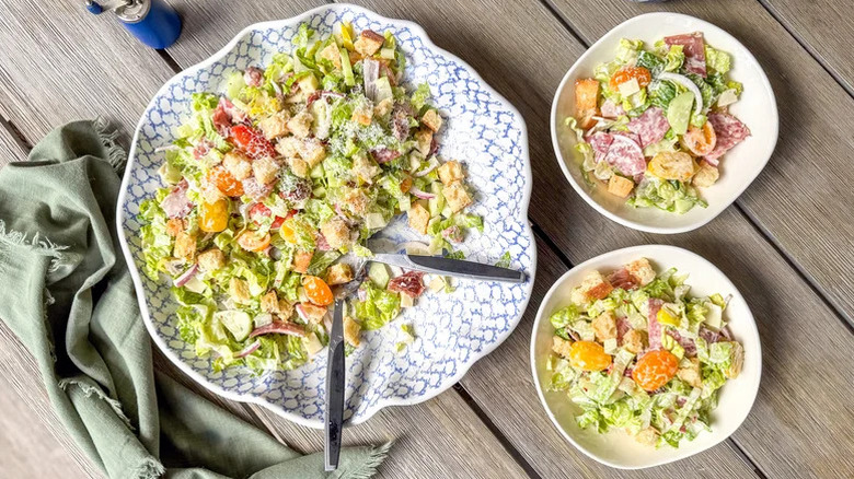 A large dish of Italian Deli Grinder Salad with two smaller servings on the side