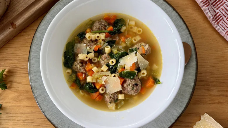 Overhead view of a large bowl of Italian Wedding Soup With Mini Meatballs