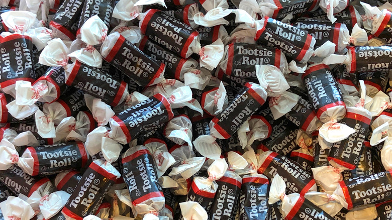 A closeup of a pile of individually wrapped Tootsie Roll candies.