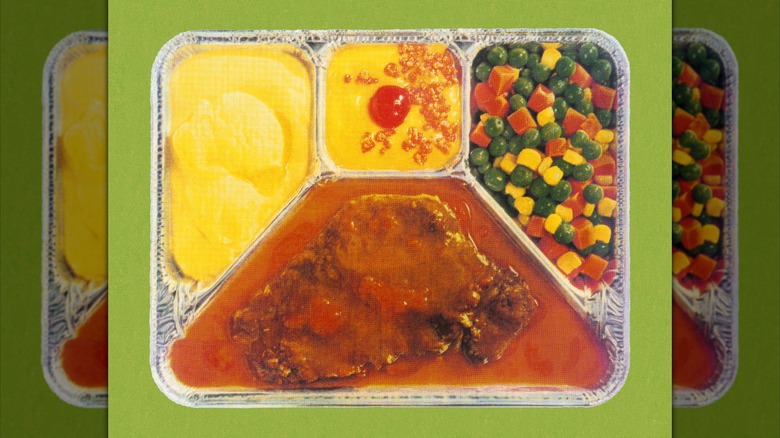 A TV dinner with turkey, gravy, and vegetables