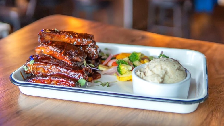 A tray of ribs and sides from Bethany Blues BBQ Pit