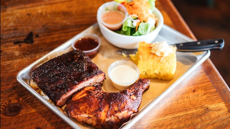 A plate of meat and sides from The Fish and the Hog