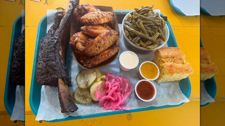 A platter of meats and sides from City Limits Barbecue