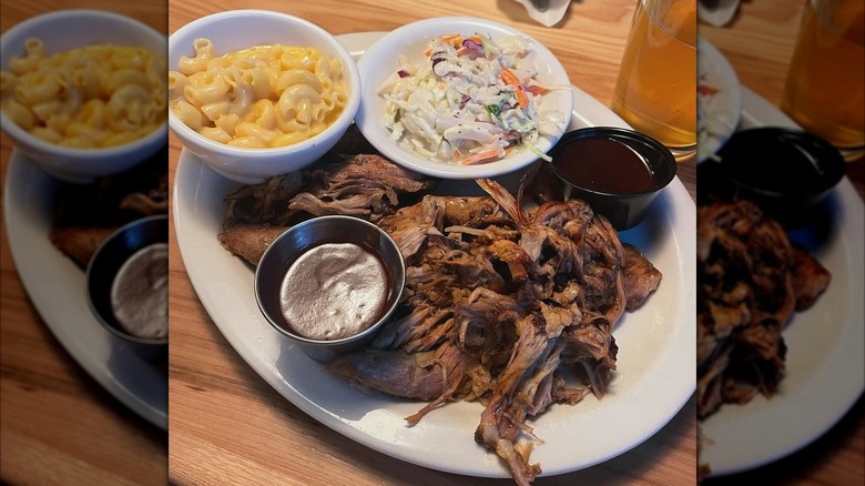 A plate with meat and sides from Bubba's Breakfast & Bar-B-Q