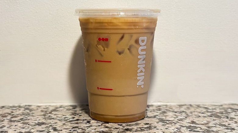 Small Dunkin' Nutty Nightmare Iced Coffee on a granite counter top