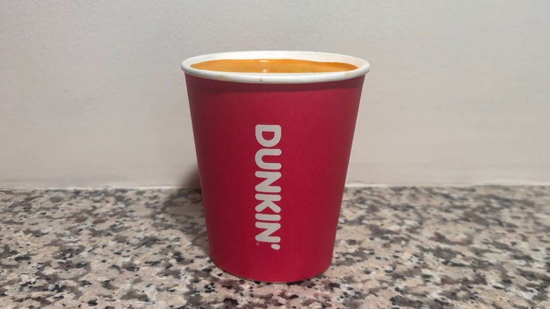 Small Dunkin' Nutty Pumpkin Coffee on a granite counter top