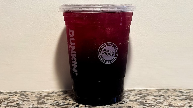 Small Dunkin' Midnight Potion Refresher on a granite counter top