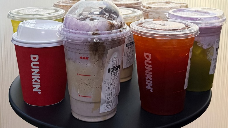 several Dunkin' fall drinks on a small black table