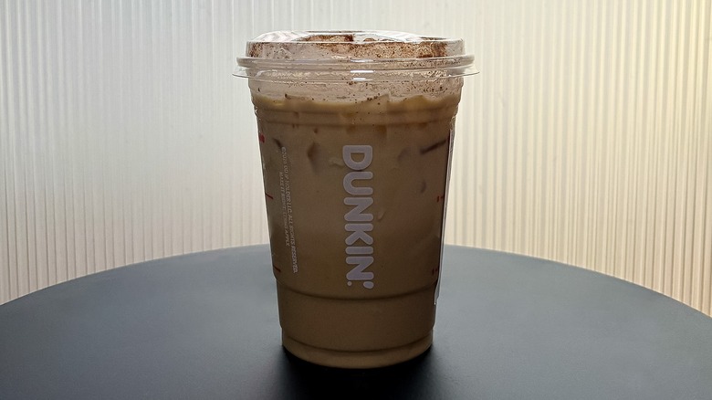 Small Dunkin' Pumpkin Patch Cloud Latte on a black table